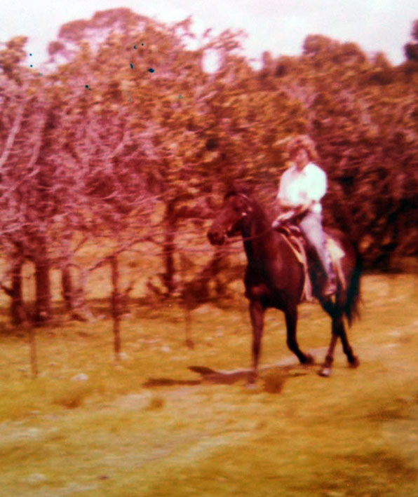 Artist riding her horse